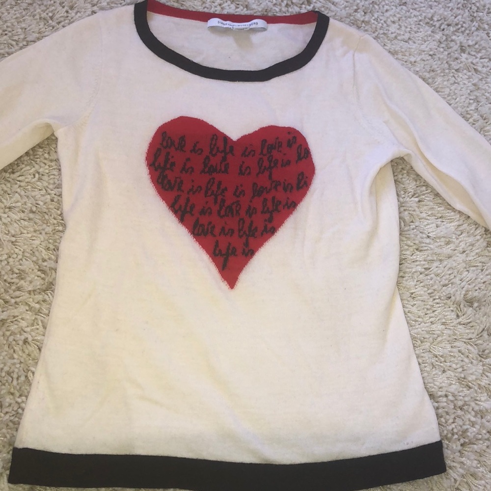 White sweater with red heart